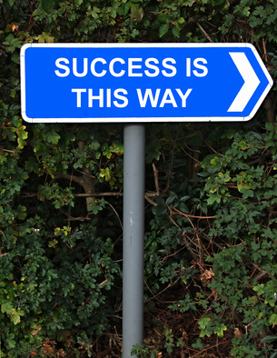 success is this way sign